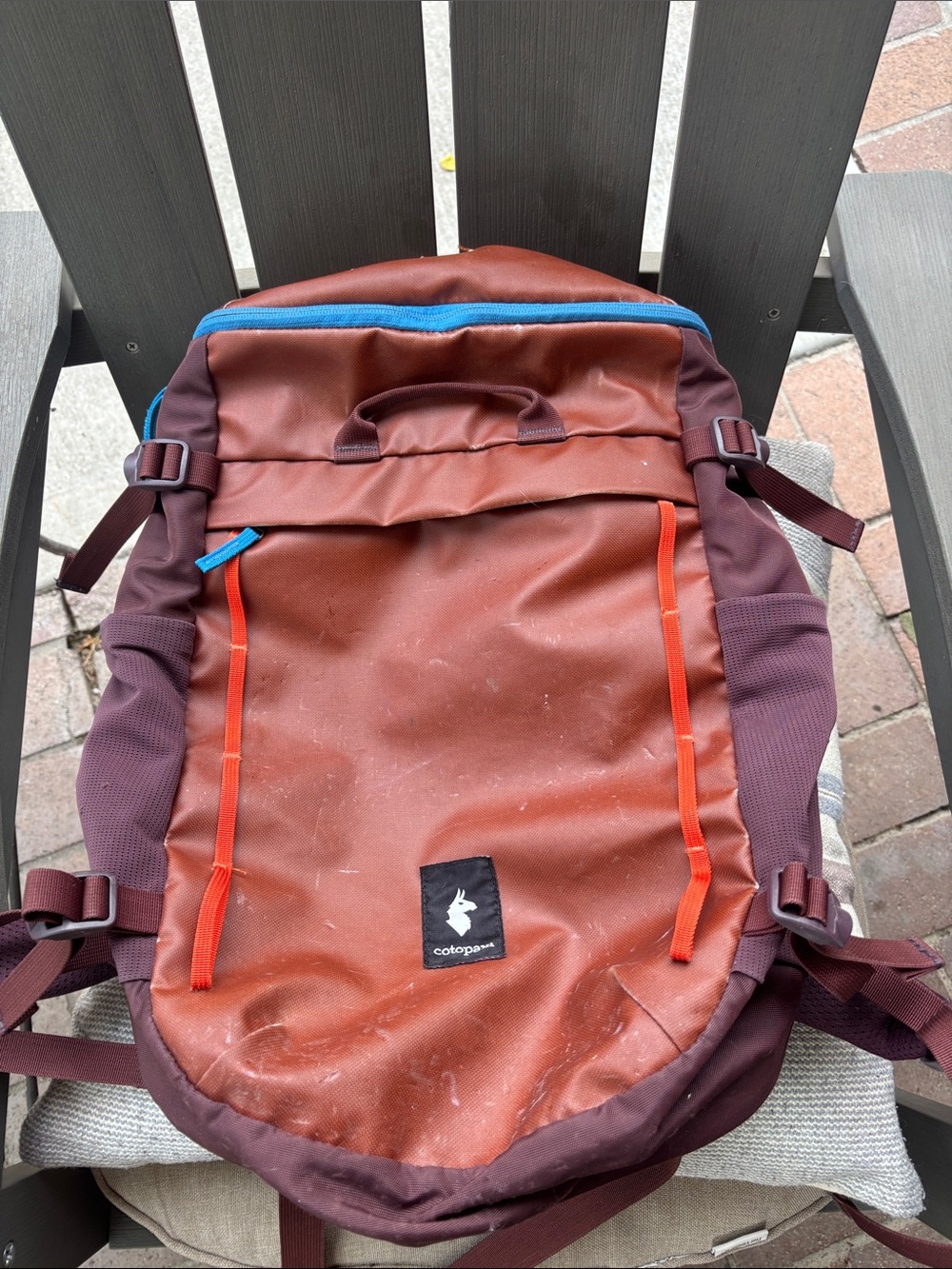cotopaxi Rust Brown Backpack with Blue and Orange Accents